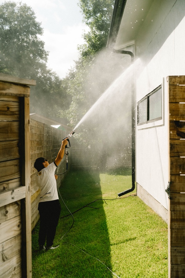 Soft washing a wood fence